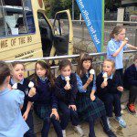 St Annes kids with ice cream 3 sitting on wall