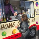 close-up-of-child-receiving-ice-cream-no-face