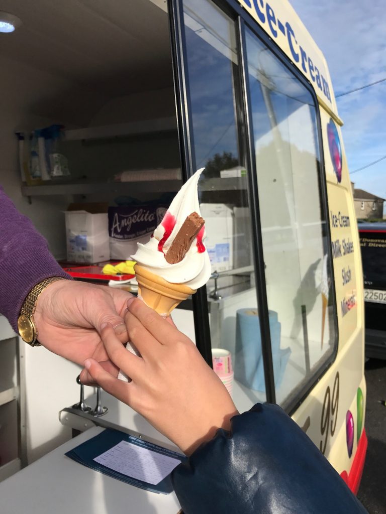 close-up-of-ice-cream-being-handed-over-no-faces