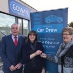 Maura Duffy with Liz Harper and Maurice Byrne and banner and car keys