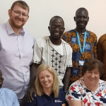 Caption 1. Michael and his fellow volunteers with some of the NACCUG Compliance Officers.