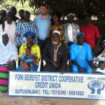 Caption 4. Michael and Mary with the Board of Foni Berefet District Cooperative Credit Union.